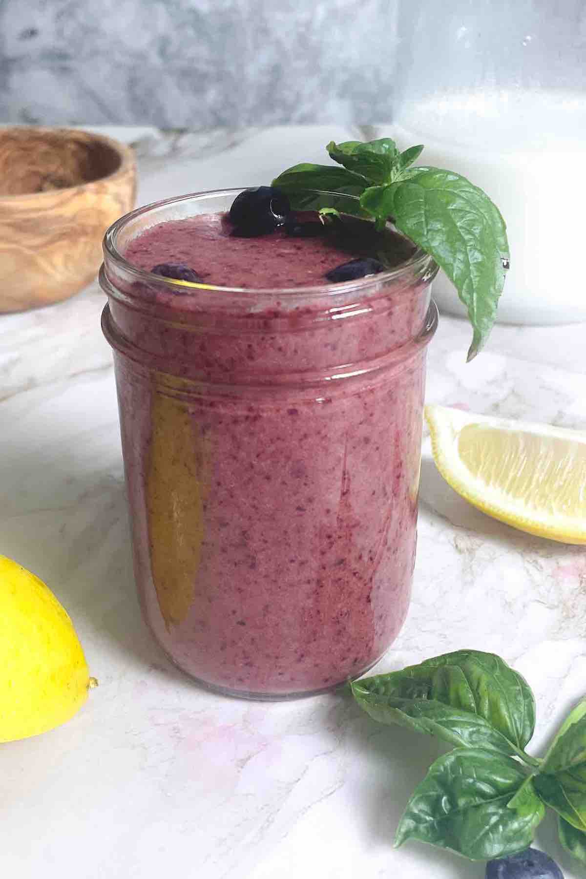 blueberry basil smoothie in a cup