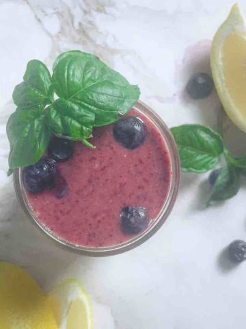 blueberry basil smoothie in a cup