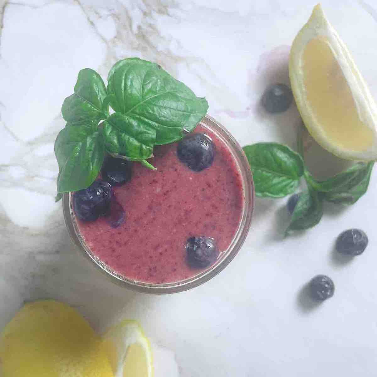 blueberry basil smoothie in a cup