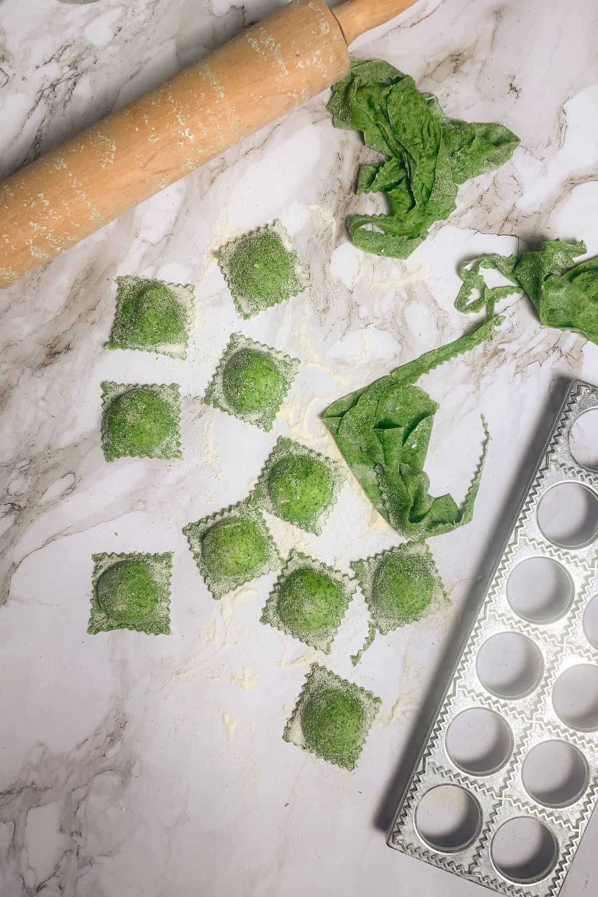 green ravioli on a countertop
