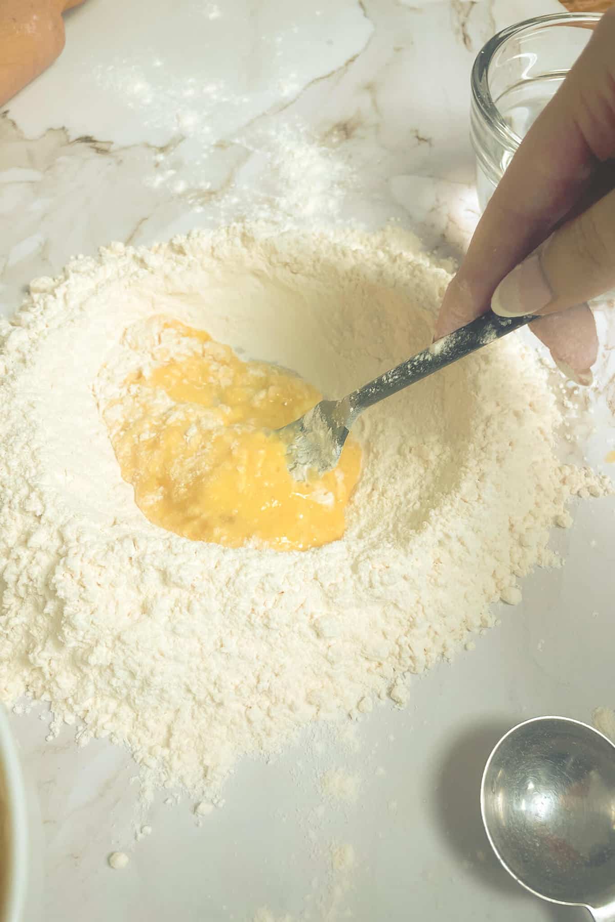 mixing eggs and flour with a fork