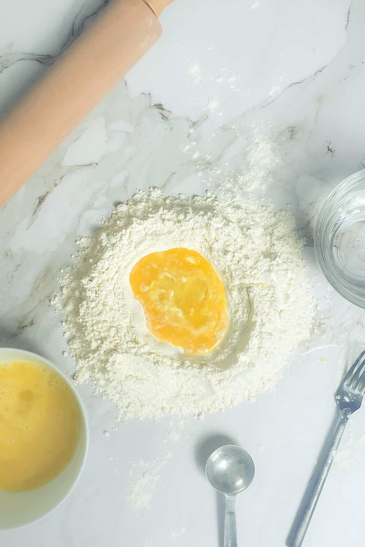 pasta making process, mixing eggs and flour