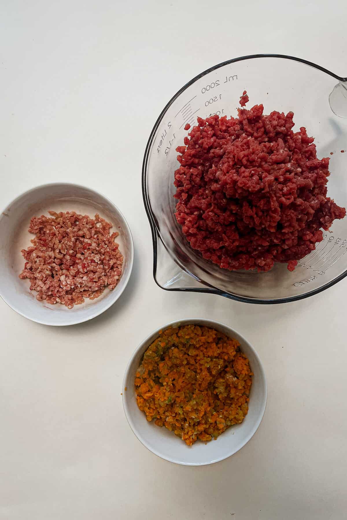 ground meat and vegatables in bowls