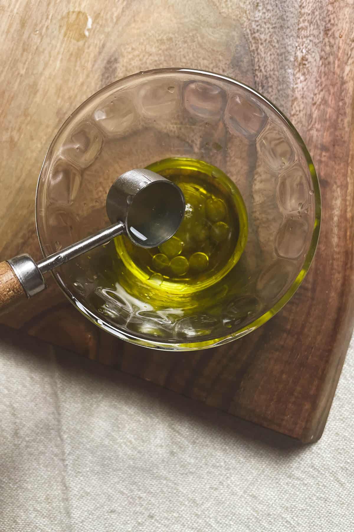 mixing salad dressing in a small bowl