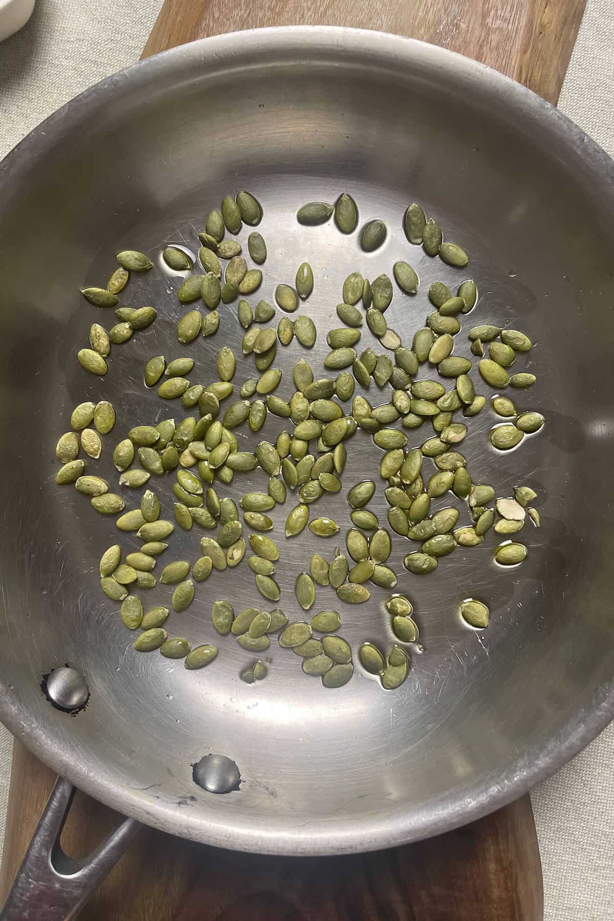 toasted pumpkin seeds in a pan