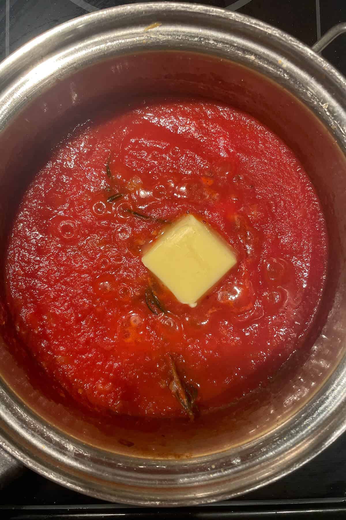 tomato sauce simmering in a saucepan