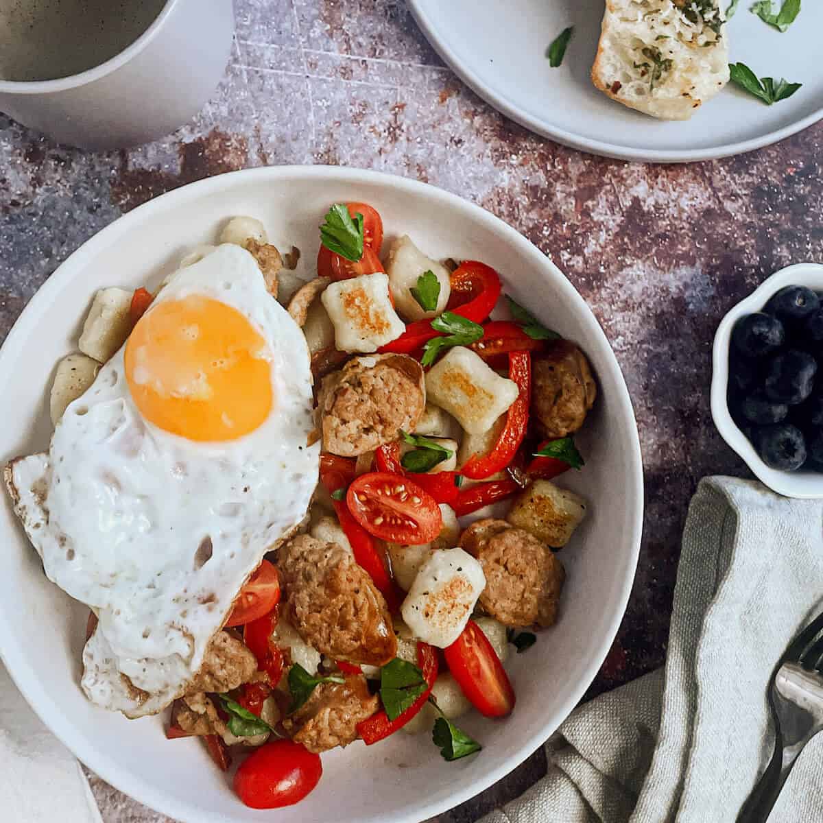 breakfast gnocchi bowl with sausage and peppers