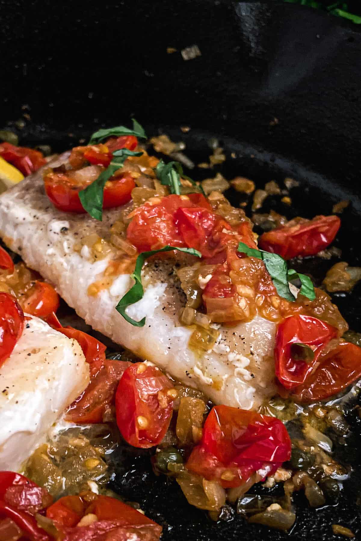 tuscan cod in a cast iron skillet