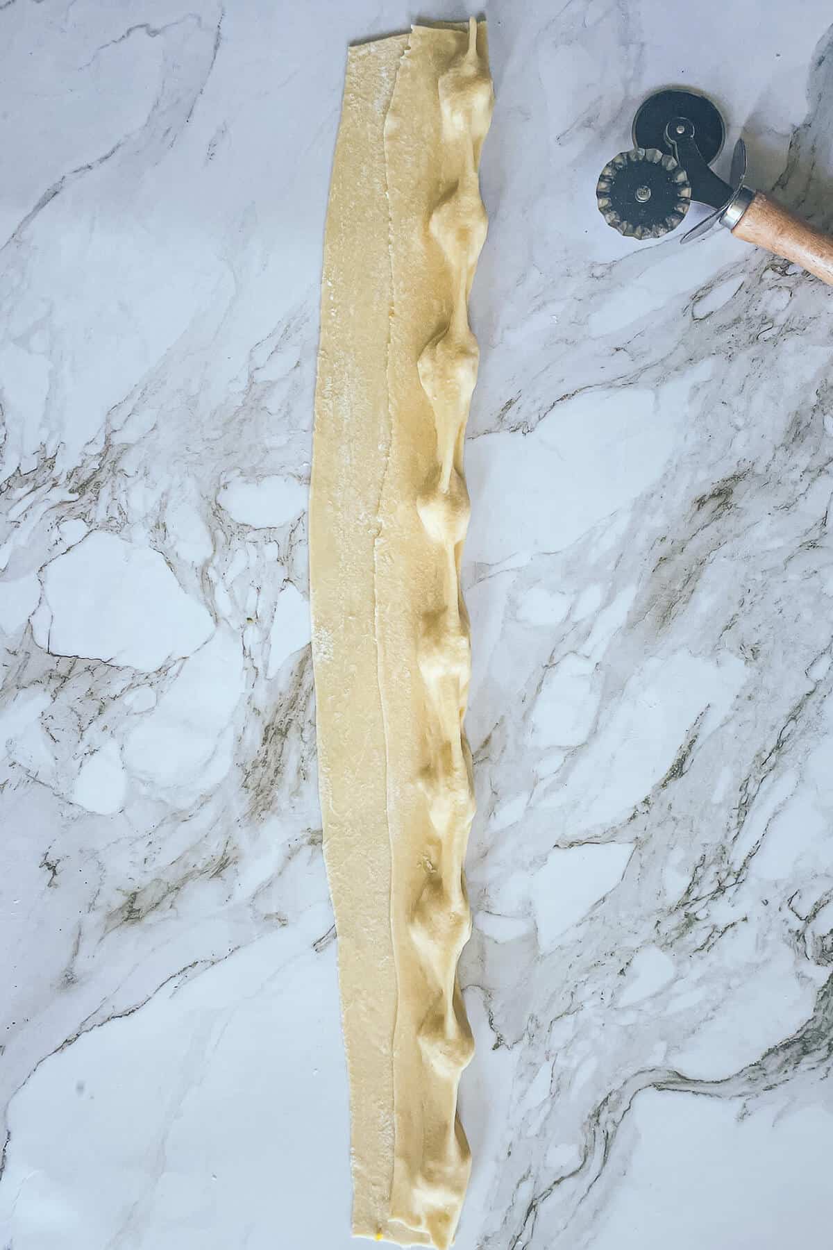 folded pasta dough with filling inside