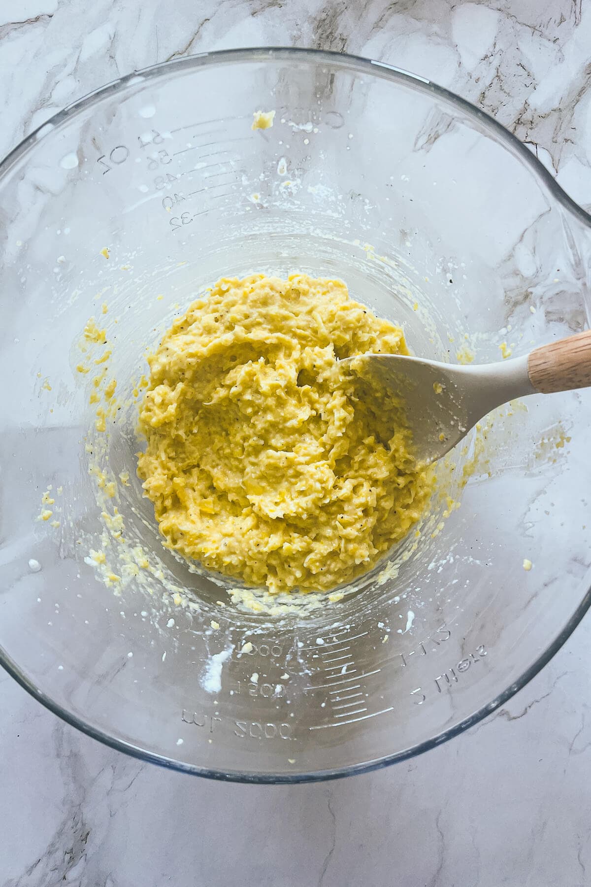 corn and ricotta filling in a bowl with a spoon